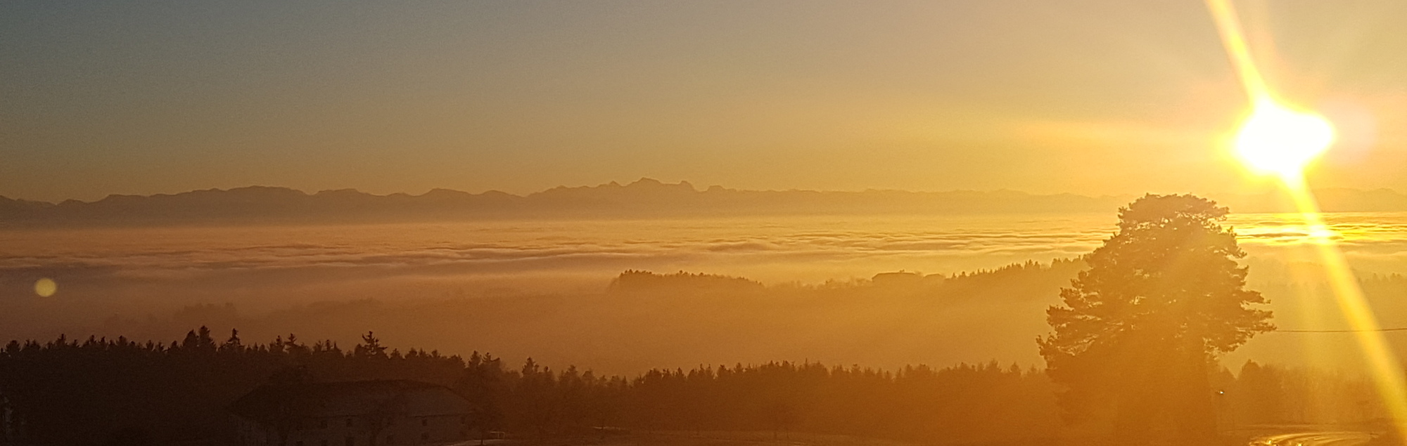 Sonnenuntergang mit Alpenblick